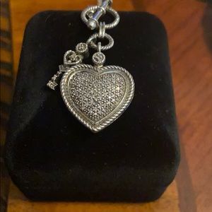 Sterling silver with real diamond heart pendant.